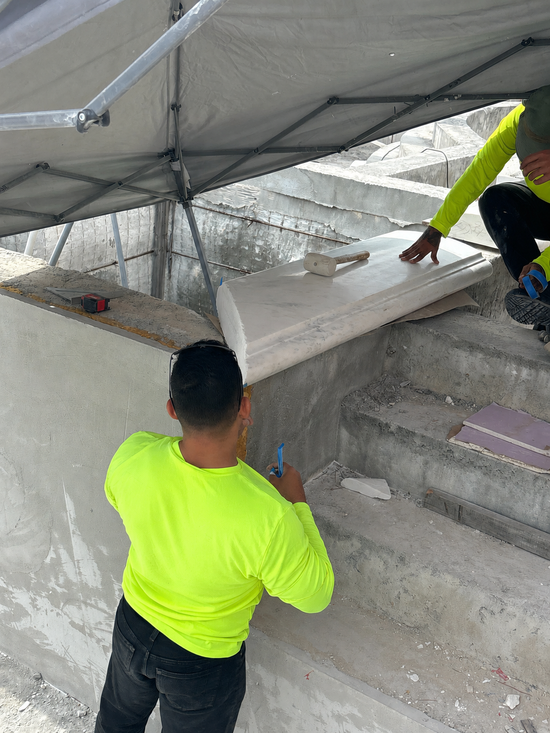 Field documentation of marble and stone construction work managed by Eduardo Munoz Perez JR